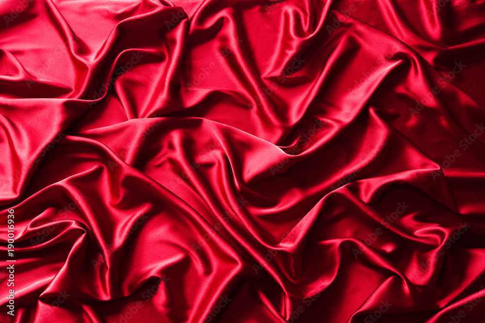 Fototapeta premium Texture of red silk satin