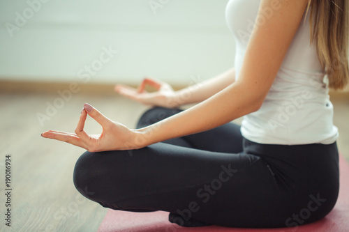 Young woman meditates while practicing yoga. Freedom concept photo