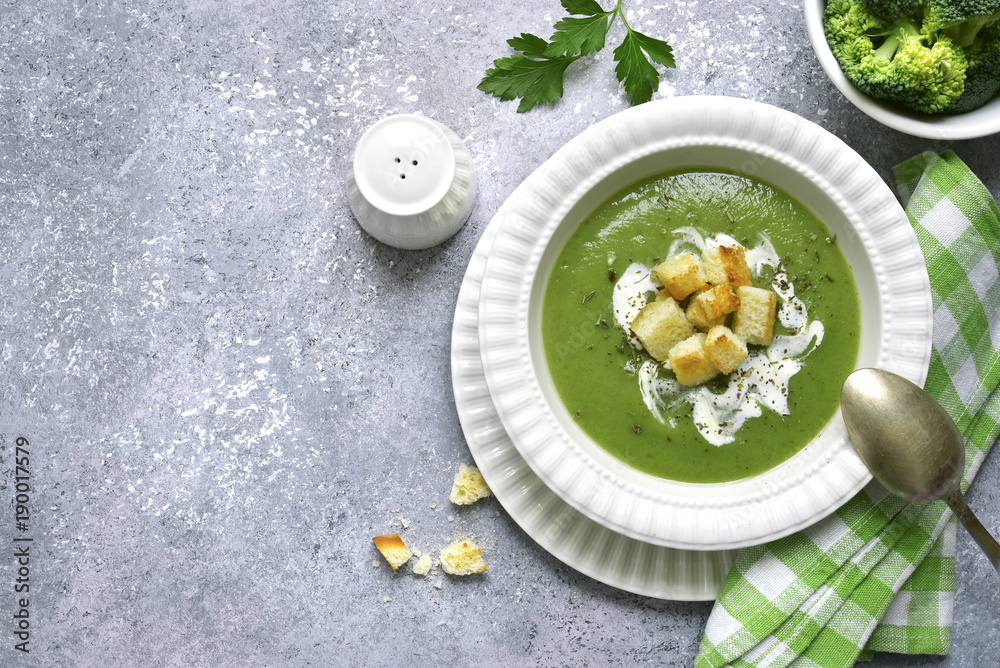Broccoli pureed soup with croutons.Top view. Broccoli pureed soup with croutons.Top view.