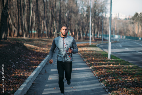 Male runner in sportswear on training outdoor