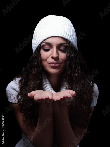 Woman with natural curly hair isolated on a black background