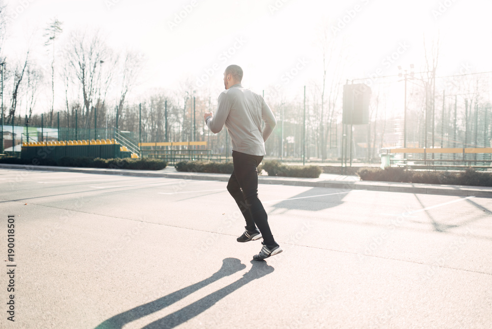 Runner in motion, speed running, healthy lifestyle Runner in motion, speed running, healthy lifestyle