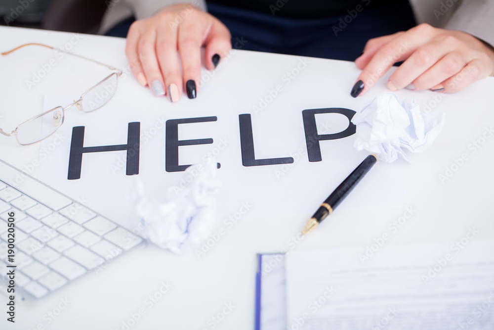 Close up girl hand putting signature on document. She situating at desk. Business concept. Low angle Close up girl hand putting signature on document. She situating at desk. Business concept. Low angle