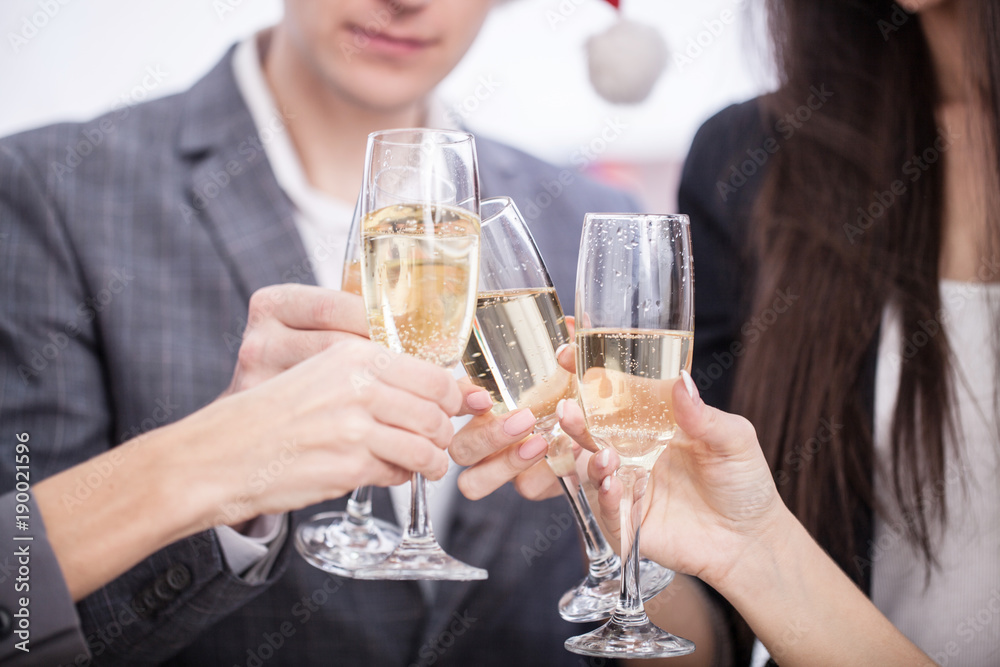 Close up of business team toasting with Champagne Close up of business team toasting with Champagne