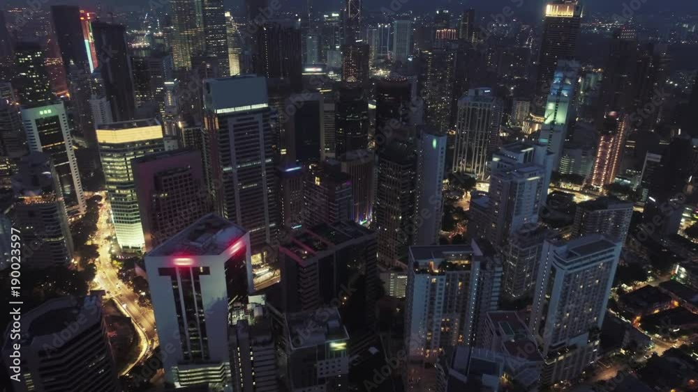 AERIAL. Cinematic view. Hight view to Kuala Lumpur city, Malaysia. Cityscape business skyscrapers night downtown. AERIAL. Cinematic view. Hight view to Kuala Lumpur city, Malaysia. Cityscape business skyscrapers night downtown.