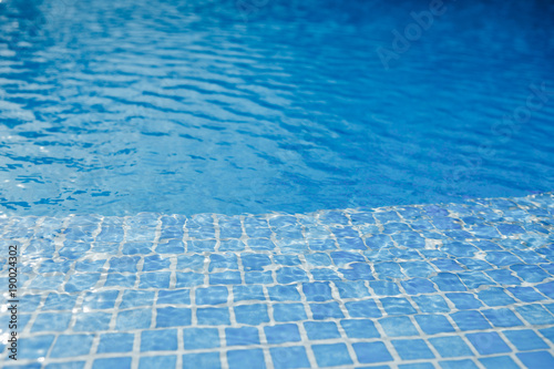 swimming pool with blue water and tile