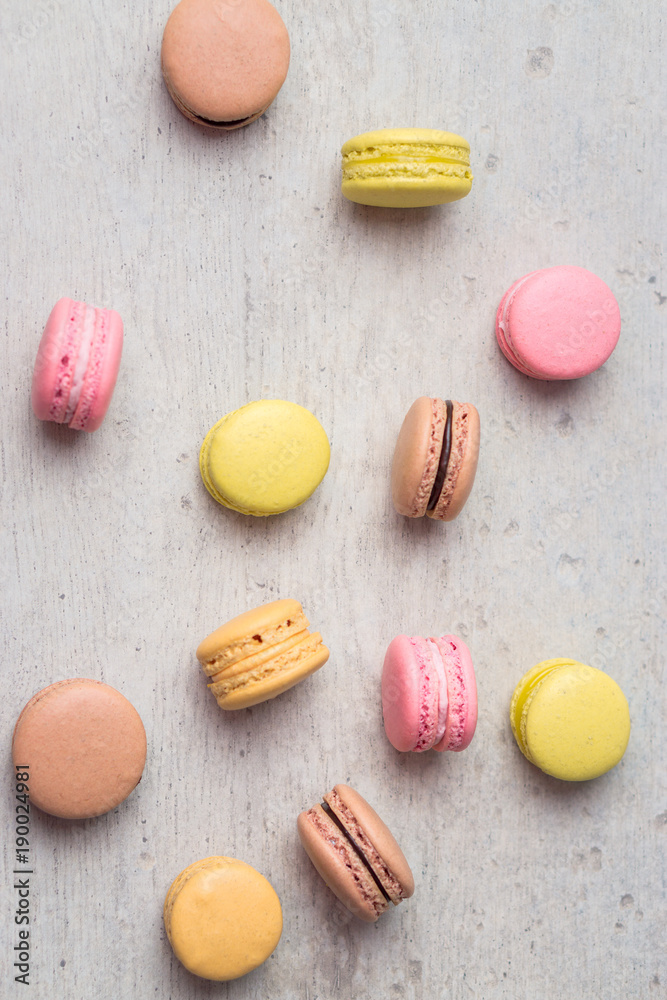 Obraz premium Macaron from above. Macarons are small round delicious french confections, made with meringue and sweet flavored filling. Often found in french bakeries, these tasty treats are light & crisp!