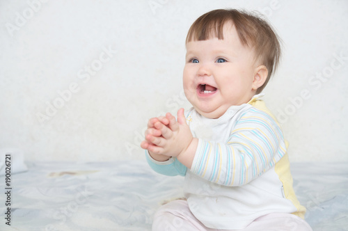 happy smiling clapping hands cute baby, caucasian blue eyes cheerful infant playing funny