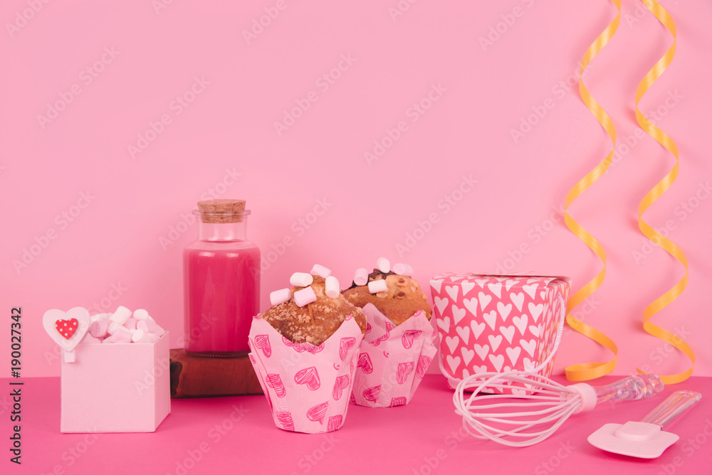 Muffins in colorful paper baking cup with red hearts. Muffins in colorful paper baking cup with red hearts.