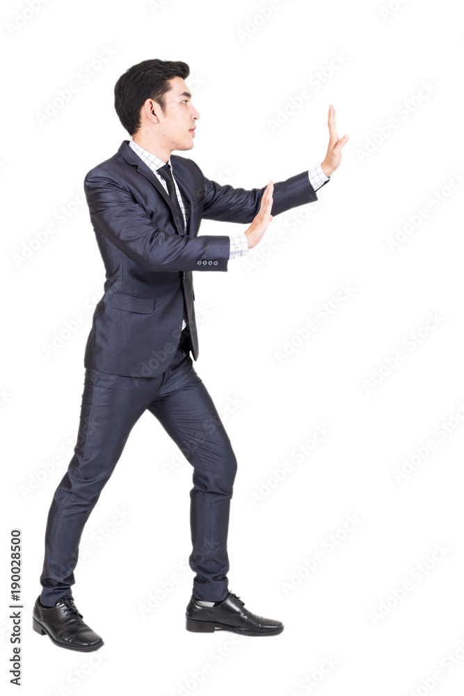 Businessman pushing something isolated on white background