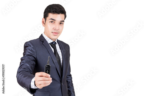 Man dealer giving car keys to you.dealership and rental concept