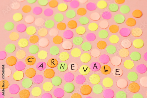 Carnaval party background concept. Space for text, copyspace. Warm colors: pink, yellow and orange.