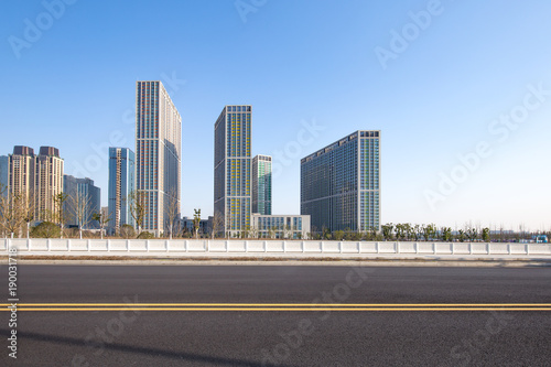 modern buildings near road in modern city © zhu difeng