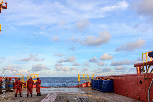 In offshore oil and gas crew boat of supply boat waiting and discuss about job during transfer passenger between boat and platform.