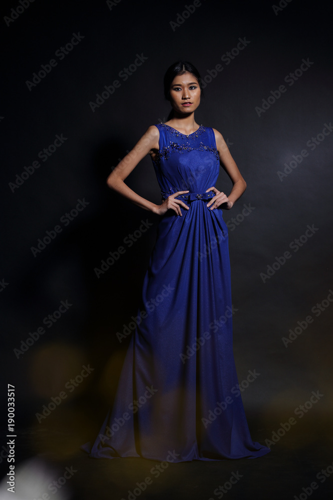 Asian woman in evening long ball dress