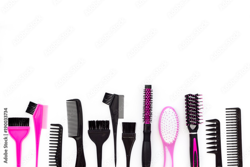 Hairdressing tools. Pattern with various combs and brushes on white background top view copy space