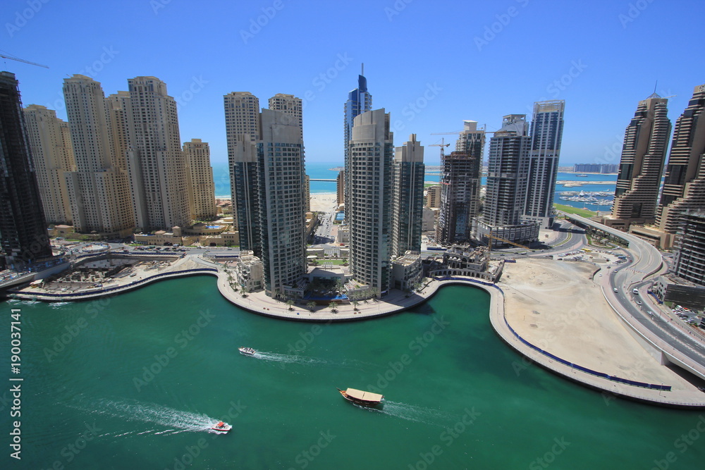 dubai marina, one of the best high-end residence area in the world, in a sunny day, with the view of Arabic Bay, or Persia Bay, canal, and some famous skyscrapers and luxury hotels