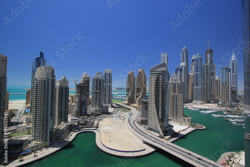 dubai marina, one of the best high-end residence area in the world, in a sunny day, with the view of Arabic Bay, or Persia Bay, canal, and some famous skyscrapers and luxury hotels