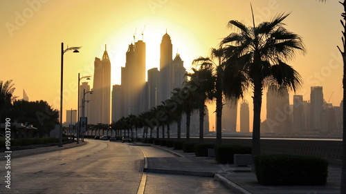 Photography the skyline of Dubai marina from the artificial Palm Jumeirah island under the s