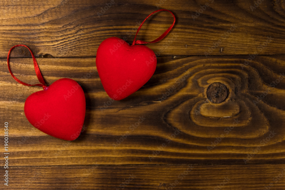Two red hearts on wooden background Two red hearts on wooden background