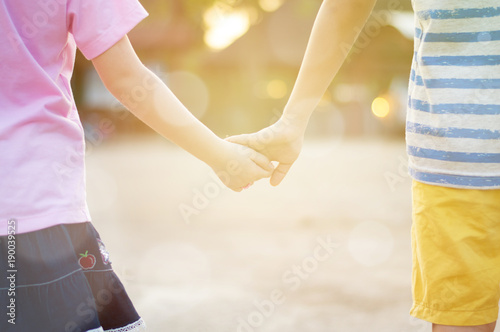 Couple of Little boy and girl stand and holding hand together love family concept,selective focus.