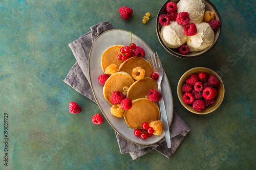 Freshly baked pancakes with raspberries