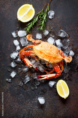 Cooked crab on a stone or slate background. Flat lay. Top view with copy space.