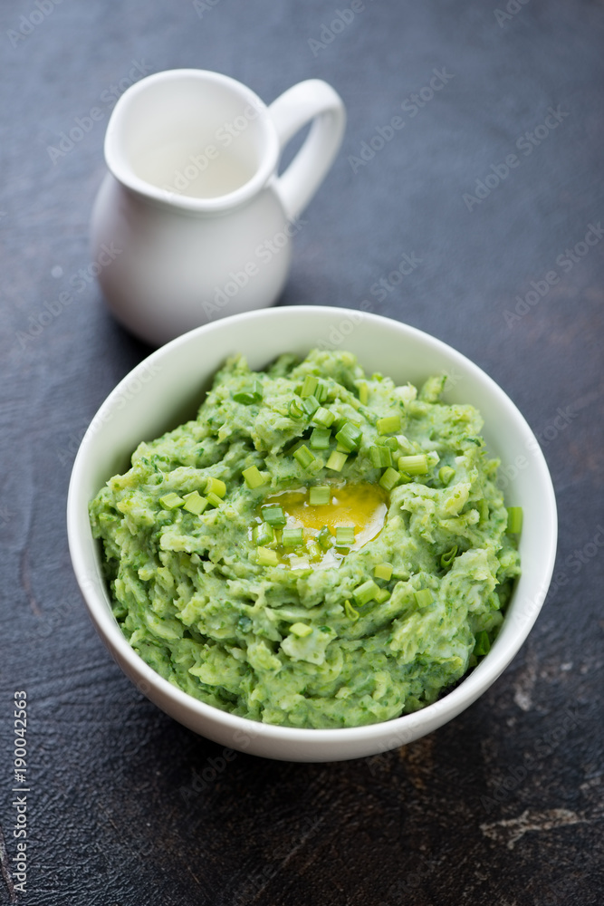 Traditional Irish colcannon served for Saint Patrick’s Day, dark brown stone background, studio shot Traditional Irish colcannon served for Saint Patrick’s Day, dark brown stone background, studio shot