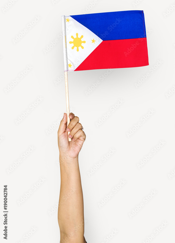 Hand holding philippine flag stock photo adobe stock