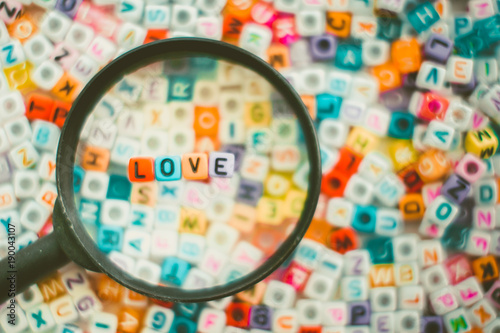 Word LOVE on the magnifying...