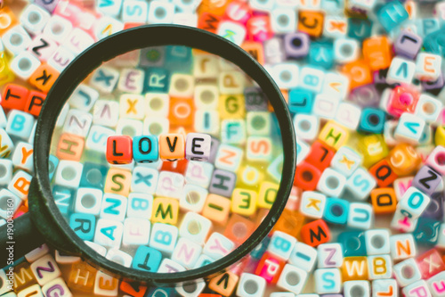 Word LOVE on the magnifying...