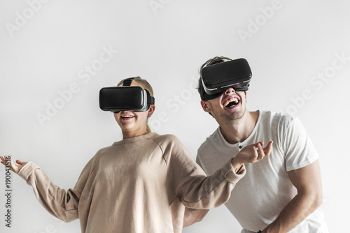 White couple experiencing virtual reality with VR headset