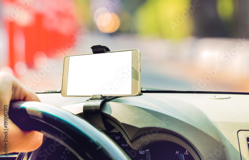 Mockup image of car holding mobile phone with blank white screen in car © escapejaja