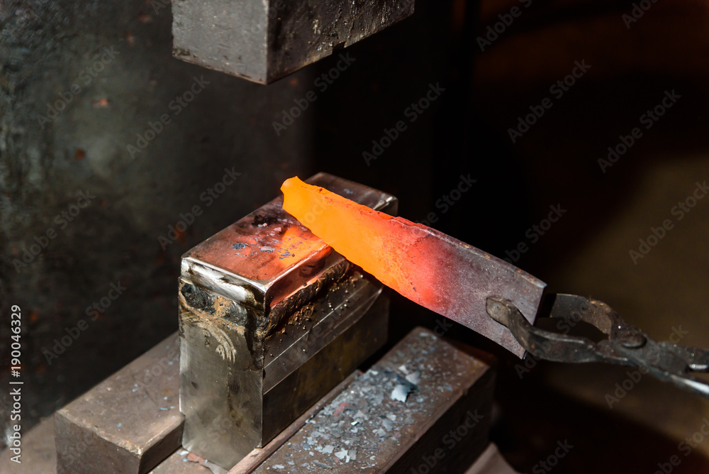 Forging molten metal. Making knives. Forging molten metal. Making knives.