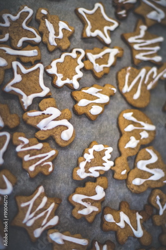 Vanilla cookies on white baking paper sheet.