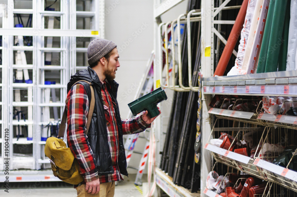 Man in a hardware store Man in a hardware store