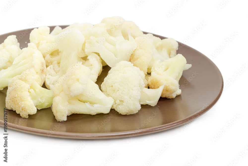 Frozen cauliflower on the brown dish with selective focus Frozen cauliflower on the brown dish with selective focus