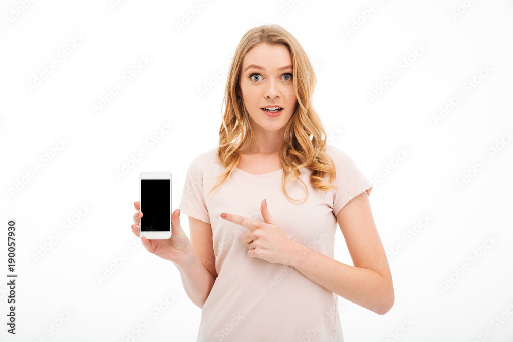 Cute young lady showing display of mobile phone Cute young lady showing display of mobile phone