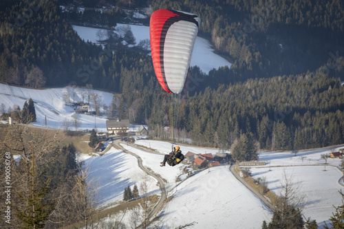 paragliding from mountain schoeckl in styria, austria photo