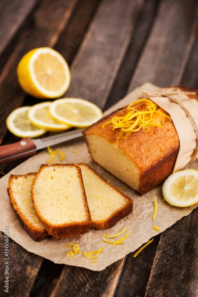 Classic lemon pound cake on rustic wooden background Classic lemon pound cake on rustic wooden background