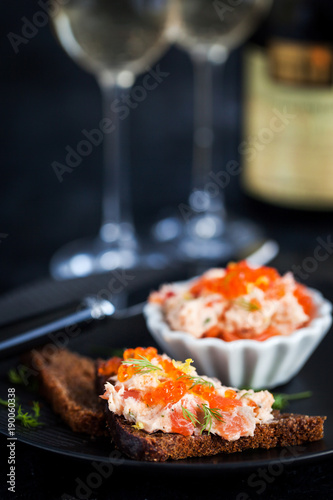 Salmon pate  with red caviar served with sliced bread