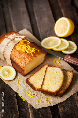 Classic lemon pound cake on rustic wooden background