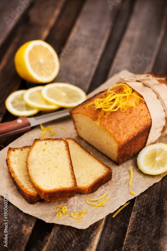 Classic lemon pound cake on rustic wooden background