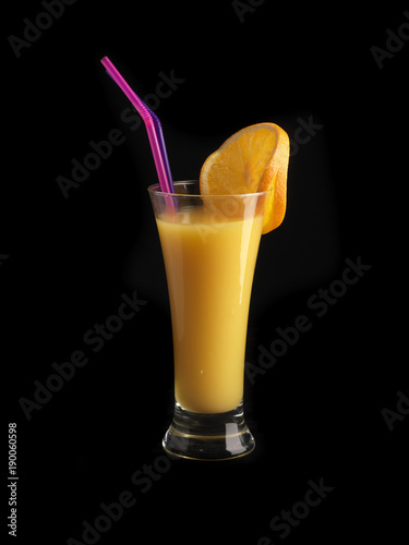 orange juice on black background