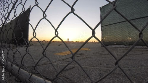 Time lapse slider of airport behind chainlink fence at Hollywood Burbank Airport