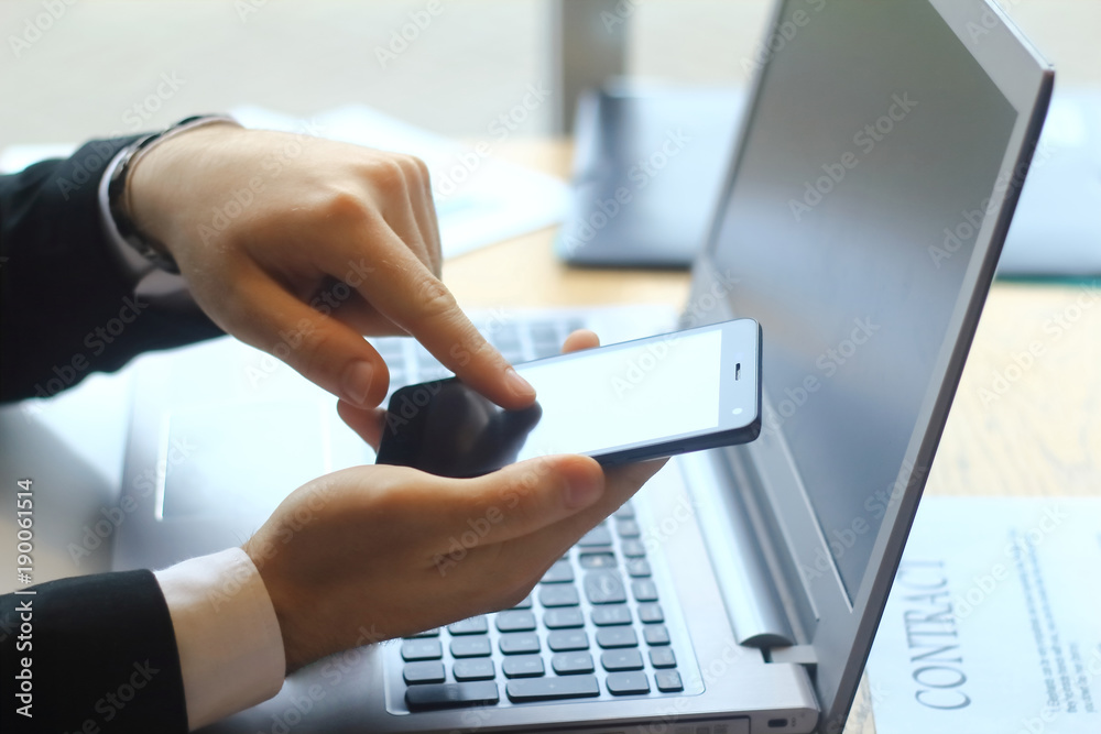 closeup.businessman typing SMS on the smartphone closeup.businessman typing SMS on the smartphone