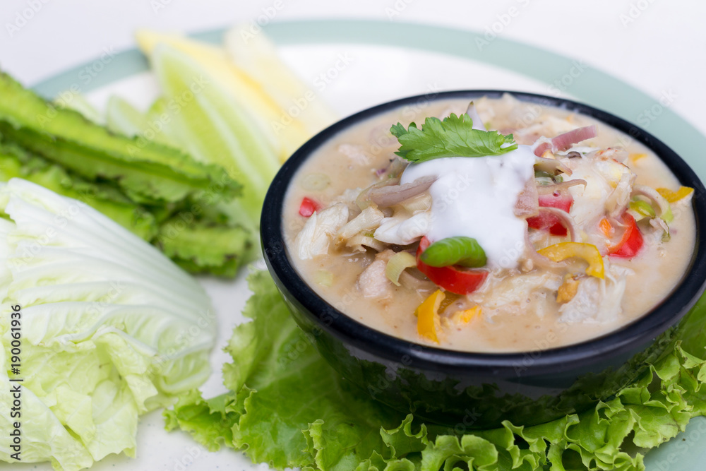 Crab dip with coconut milk and vegetables in bowl. Crab dip with coconut milk and vegetables in bowl.