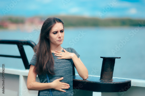 Obraz na plátne Sea sick woman suffering motion sickness while on boat