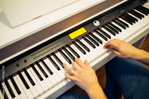 Man playing the synthesizer keyboard