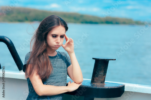 Vászonkép Sea sick woman suffering motion sickness while on boat